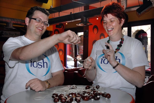 Paul Marston of IOSH playing conkers with Michelle Muxworthy, Chair of the Yorkshire banch of Institution of Occupational Safety and Health (IOSH) at the 2009 Championships at the Retro bar in Barnsley  in 2009