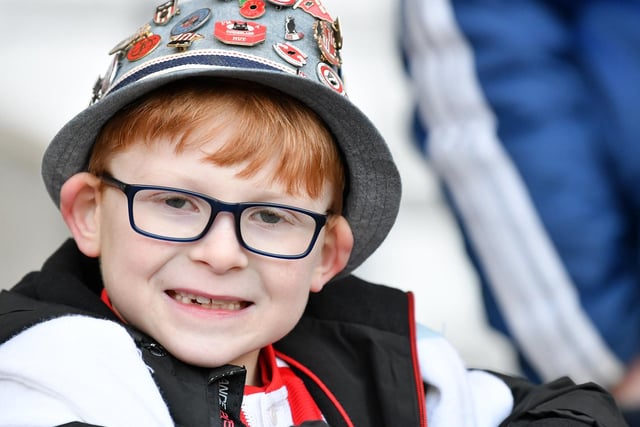 A young Sunderland fan smiles for the camera.