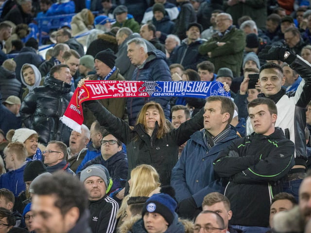 Fans with a half-and-half scarf during the second half of the game at Fratton Park.