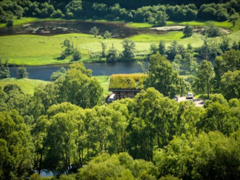 The cabins overlook the crystal clear River Glass.