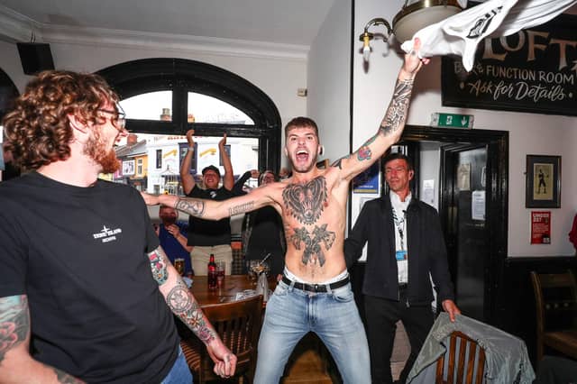 Fans pictured in The Kings pub celebrating as England score their first goal. Picture: Stuart Martin (220421-7042)