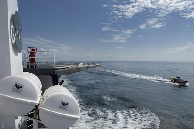 SpaceX support teams are deployed on fast boats from the SpaceX GO Navigator recovery ship ahead of the landing of the SpaceX Crew Dragon Endeavour spacecraft with NASA astronauts Robert Behnken and Douglas Hurley onboard, Sunday, Aug. 2, 2020 (Bill Ingalls/NASA via AP)