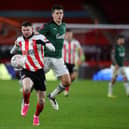 Plymouth Argyle's Keeland Watts with Oliver Burke of Sheffield United: Simon Bellis/Sportimage