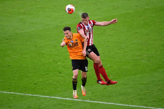 Diogo Jota of Wolverhampton Wanderers  battles for possession with  Jack O'Connell of Sheffield United  during the Premier League match between Sheffield United and Wolverhampton Wanderers at Bramall Lane. (Photo by Laurence Griffiths/Getty Images)