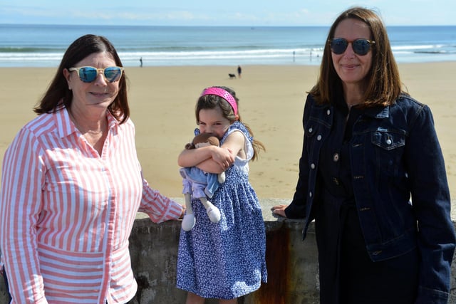 Maureen Hill, youngster Amelie Hill, four, and Adrienne Hughes enjoy a walk along Seaburn seafront.