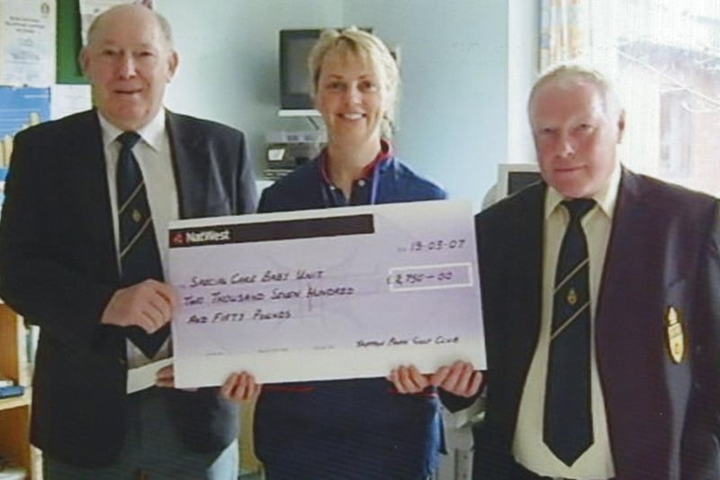 Derek Griffiths (left) and William Barker from Tapton Golf Club present £2,750 to Lynne Elliott for the special care baby unit in 2010.
