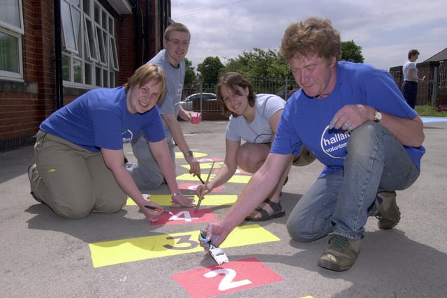 Pictured at  Longley School Nursery, Raisen Hall Road, Sheffield, where Sheffield Hallam University Union of Students were decorating the playground in 2003. Seen at work LtoR are,  Alice Sewell, Andrew Shaw, Kate Stone, and Dave Hurry.