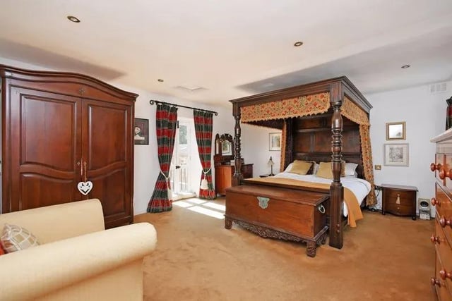 The master bedroom is found at the back of the property and has an en-suite and balcony, which overlooks a portion of the expansive grounds.