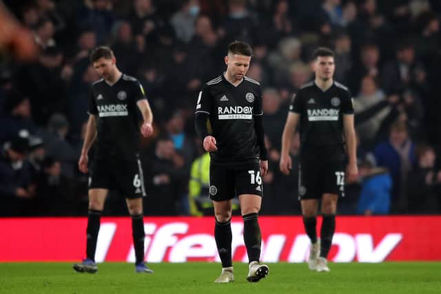 Sheffield United's players looked dejected after conceding their second goal at Derby County: Simon Bellis / Sportimage