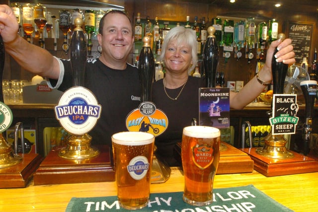 The Red Lion pub, Charles Street, Sheffield, where Landlord  Simon Gagg and bar staff member Margaret Lewin are seen behind the bar with some of the real ales on offer including Easy Rider from the Kelham Island Brewery, and Moonshine from the Abbeydale Brewery