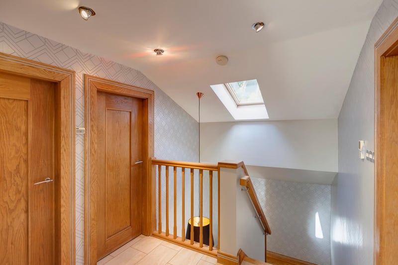 The landing is bright and light thanks to a Velux roof window, pendant light point and recessed lighting. Oak doors open to the master bedroom, bedroom 2, bedroom 3, bedroom 4 and family bathroom.