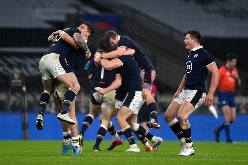 LONDON, ENGLAND - FEBRUARY 06: Stuart Hogg, Cameron Redpath and Huw Jones of Scotland celebrate following their side's victory after the Guinness Six Nations match between England and Scotland at Twickenham Stadium