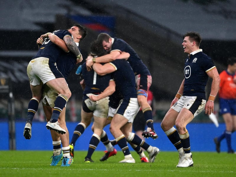LONDON, ENGLAND - FEBRUARY 06: Stuart Hogg, Cameron Redpath and Huw Jones of Scotland celebrate following their side's victory after the Guinness Six Nations match between England and Scotland at Twickenham Stadium