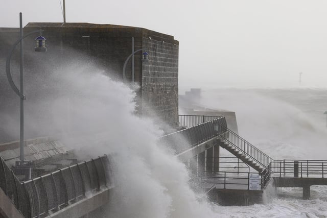 Old Portsmouth saw large waves crashing against the Hot Walls. Photos by Alex Shute