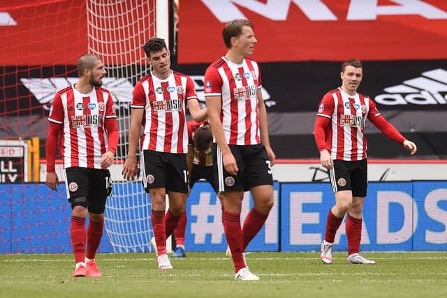 Sheffield United players react after Dani Ceballos of Arsenal (not pictured) scores his teams second goal during the FA Cup Fifth Quarter Final match between Sheffield United and Arsenal FC at Bramall Lane on June 28, 2020 in Sheffield, England. (Photo by Oli Scarff/Pool via Getty Images)