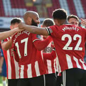 David McGoldrick of Sheffield United celebrates with teammates after scoring his team's third goal during the Premier League match between Sheffield United and Chelsea at Bramall Lane: Rui Vieira/Pool via Getty Images