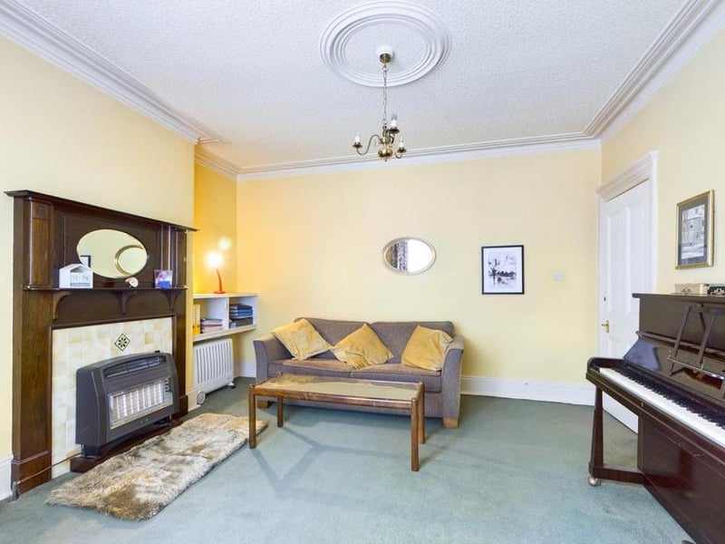 Lounge - Timber framed single glazed bay window to the front elevation, ceiling coving, wall light points, period fire surround with tiled inset and outset gas fire; power points.