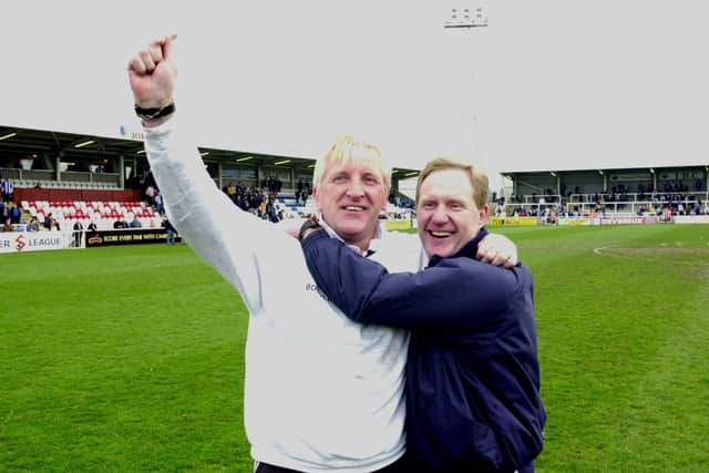 A triumphant Ronnie Moore and John Breckin celebrate promotion at Hartlepool