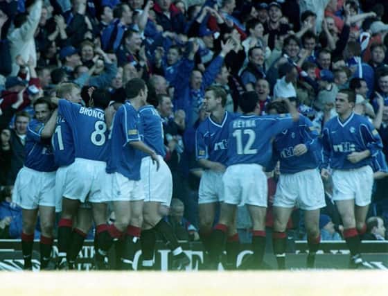 Jorg Albertz is congratulated by his team-mates after scoring for Rangers on March 26, 2000