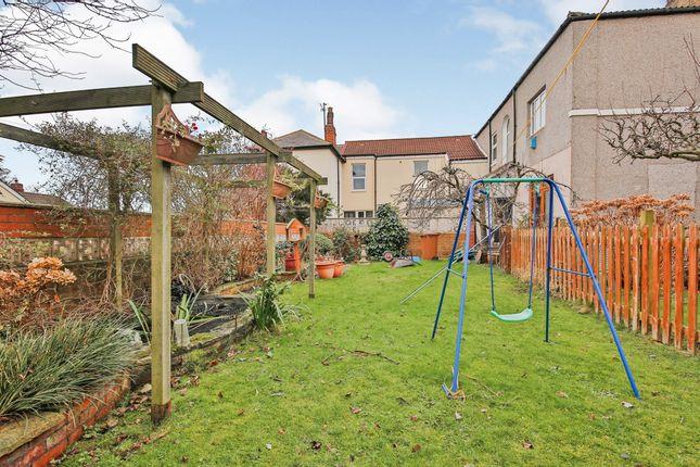 The garden features apple and pear trees, a fish pond and plenty of lawn area ideal for families.