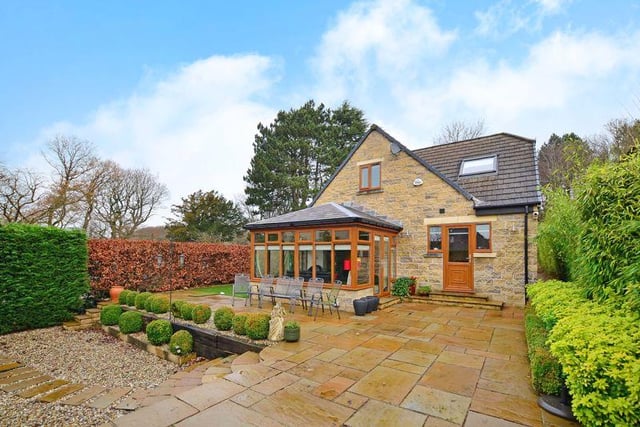There is access down both sides of the property into a south-west facing, landscaped garden with an Indian stone flagged terrace, a further terrace and a garden area with artificial grass, surrounded by mature hedging.