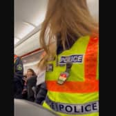 A Sheffield dad captured the moment an 'aggressive' passenger was removed from his family's Turkey-bound flight, during a two-hour emergency stop in Hungary.