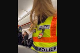 A Sheffield dad captured the moment an 'aggressive' passenger was removed from his family's Turkey-bound flight, during a two-hour emergency stop in Hungary.