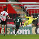 Aaron Ramsdale of Sheffield United dives but is beaten by Tanguy Ndombele's amazing finish during Sunday's Premier League fixture at Bramall Lane: Simon Bellis/Sportimage