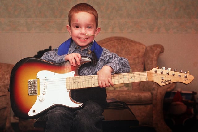 Alex Wright, 4, of Handsworth Grange Road, who in 1999 found some time to play the guitar