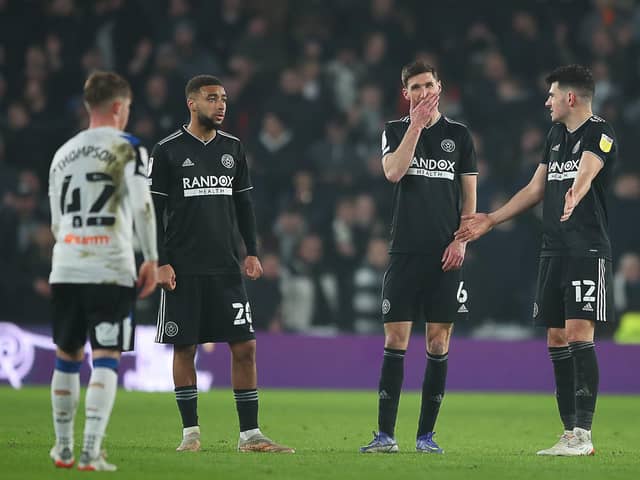 Jayden Bogle, Chris Basham and John Egan of Sheffield United look dejected after their team concede a goal to make it 2-0 during the Sky Bet Championship match at Pride Park Stadium, Derby. Picture credit should read: Simon Bellis / Sportimage