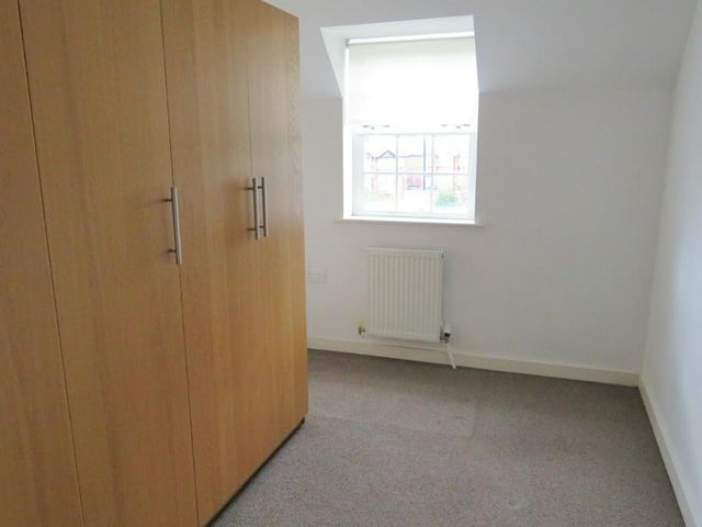 Bedroom 2 - A double room with a front facing double glazed window and a central heating radiator.