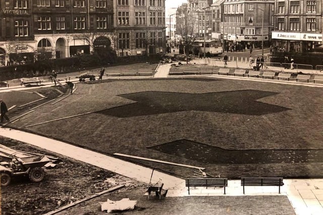 A view of Peace Gardens by the Town Hall showing the work done so far in redesigning them and the shape of the new flowerbeds beginning to show in March 1976