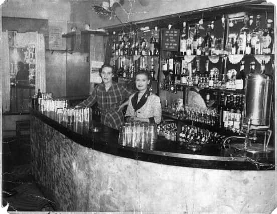 Phoebe Williams and Peggy Bate behind the bar at the Attercliffe Palace, Sheffield, in around 1950