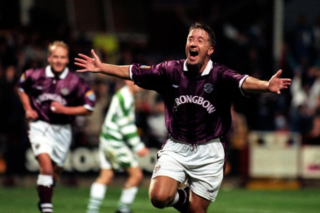 John Robertson celebrates scoring the only goal of the game as Hearts overcame being without four suspended defenders to defeat Celtic 1-0 in the League Cup quarter-final.