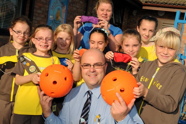 Brownies from Mortimer Primary School receive a Sainsbury's Active Kids Paralympic Challenge kit from store manager Lee Chilton and Dawn Nixon. Were you one of the people pictured in this 2009 scene?