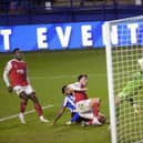 Sheffield Wednesday's Mallik Wilks puts Josh Earl under pressure causing the Fleetwood Town defender to score an own goal and the equaliser for the Owls in the FA Cup fourth round tie at Hillsborough. Picture: Steve Ellis