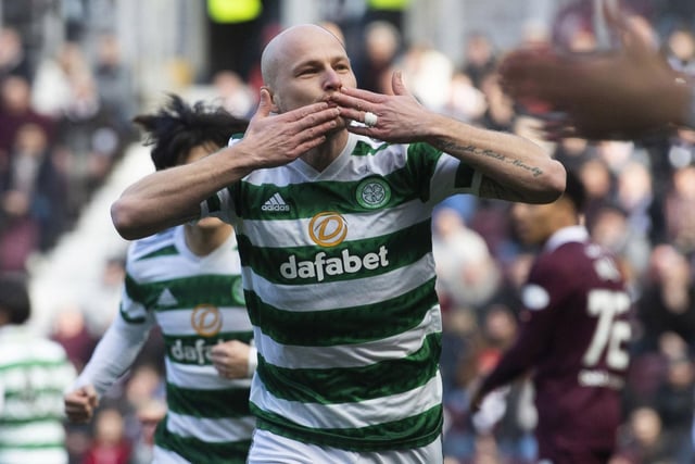 Celtic’s Aaron Mooy wheels away in celebration after the Australian midfielder crashed in an early opener against Hearts at Tynecastle.