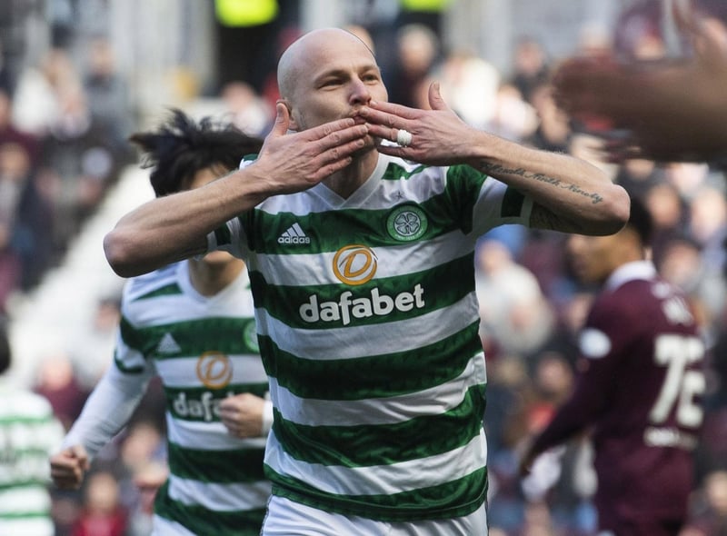 Celtic’s Aaron Mooy wheels away in celebration after the Australian midfielder crashed in an early opener against Hearts at Tynecastle.
