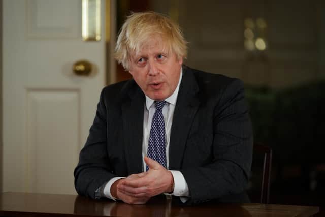 Prime Minister Boris Johnson, gestures as he records an address to the nation at Downing Street, London, to provide an update on the booster vaccine programme. See PA story HEALTH Coronavirus. Photo credit should read: Kirsty O'Connor/PA Wire