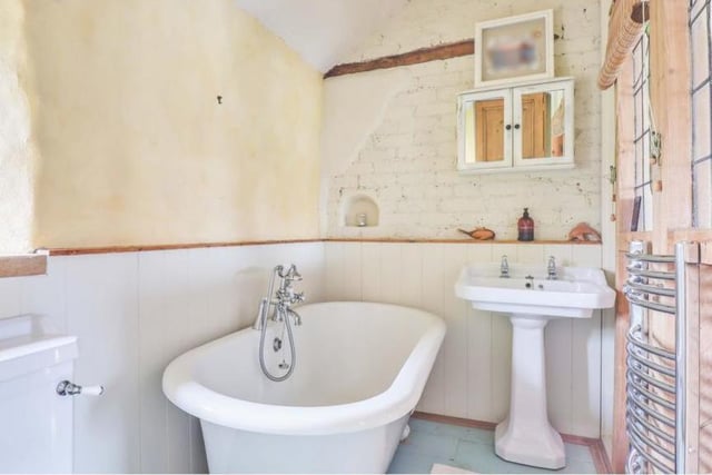 A free-standing, roll-top bath with claw-footed feet is the highlight of the family bathroom on the first floor.