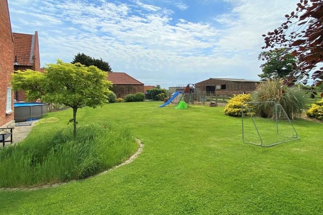 See how the garden stretches away into the countryside. Lots of room for playing games too.