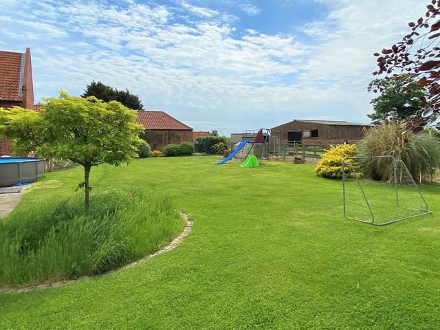 See how the garden stretches away into the countryside. Lots of room for playing games too.