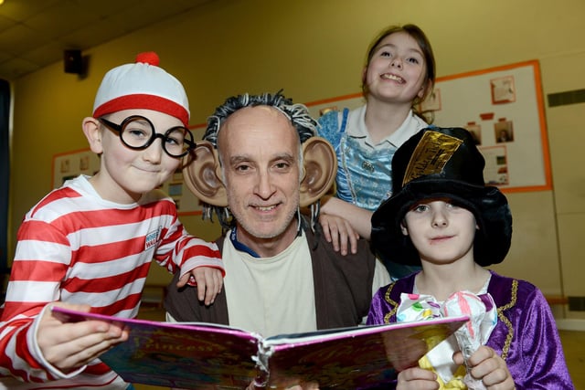 Lynnfield Primary School staff member Brian Umpleby with pupils (left to right) Alex Burn-MCrossen, Jade Chawner and Riley Stead dressed for World Book Day in 2019.