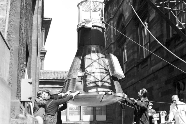 A view of the space capsule Freedom 17 being hoisted into the Royal Museum of Scotland, in Chambers Street, in 1966.