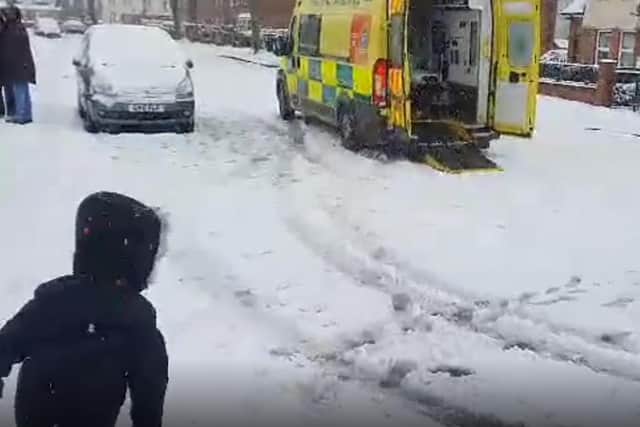 The heartwarming footage shows firefighter joining the child for a snowball fight in the Firth Park area