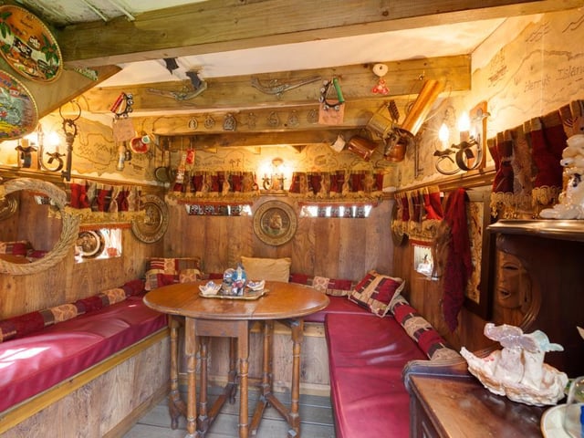 Nestled in the garden is an impressive wooden pirate ship; this is ideal for children’s games and boasts inside seating and ornate wooden decor.