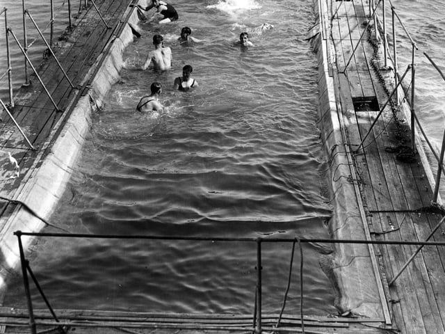 20th August 1936: St Clement Danes Sea Cadets enjoying a swim in the floating swimming pool alongside the battleship 'Implacable', Portsmouth, where they are based for a fortnight's training. (Photo by E. Dean/Topical Press Agency/Getty Images)