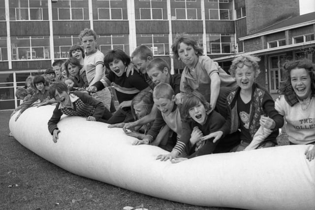 Playing on the inflatable balloon at the 1975 Castletown play scheme. Recognise anyone?