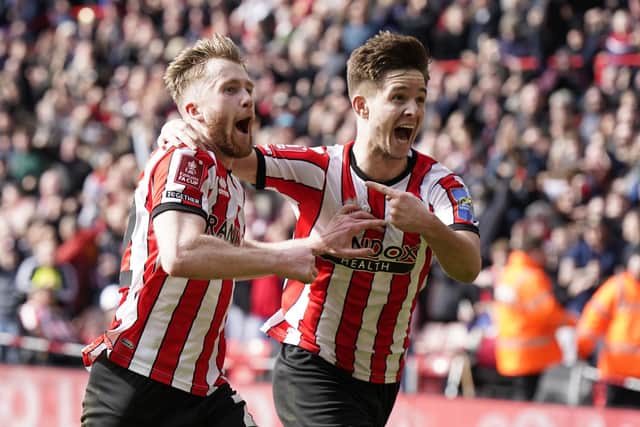 James McAtee with his Sheffield United and Manchester City team mate Tommy Doyle: Simon Bellis / Sportimage