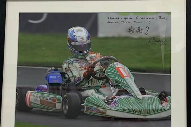 A signed photo of Guanyu Zhou in the Strawberry Racing UK office.